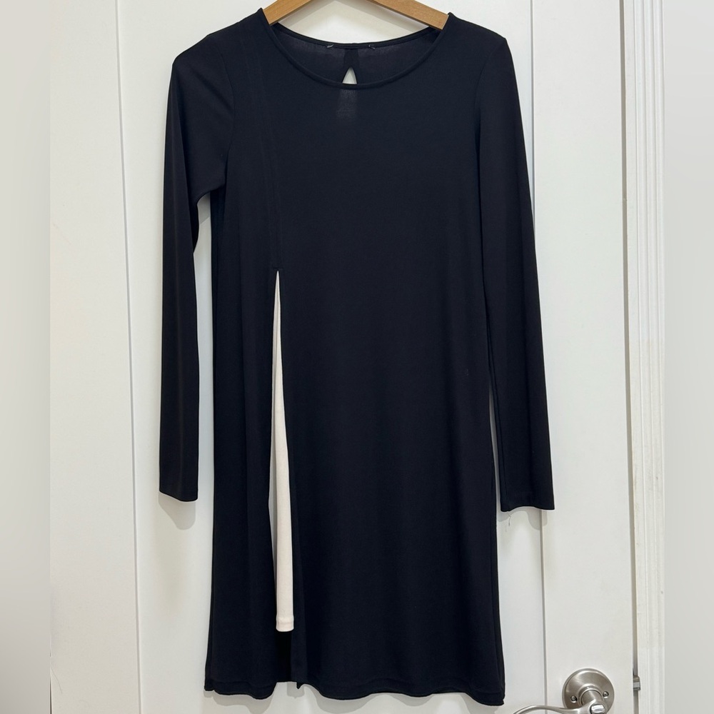Black dress (size small) with open cut white detail on one leg.